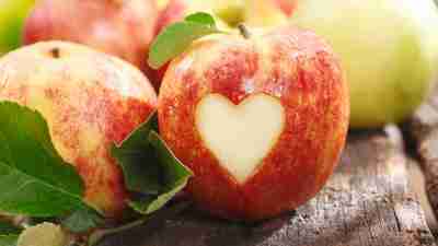 An apple with a heart cutout, a metaphor for how good it feels to stick to ADHD weight loss goals