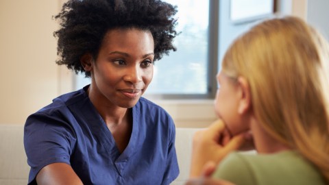 Nurse treating ADHD girl teen