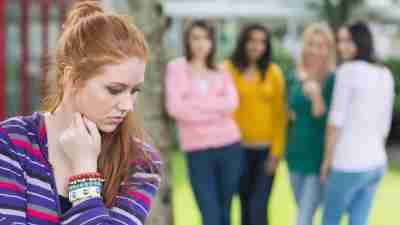 Teen girl with ADHD being bullied by group of high school kids