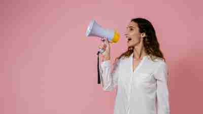 Woman with a megaphone, hormone health, menstrual cycle