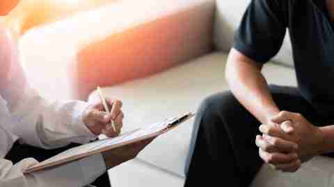 A patient in therapy with a doctor, one available treatment for depression.